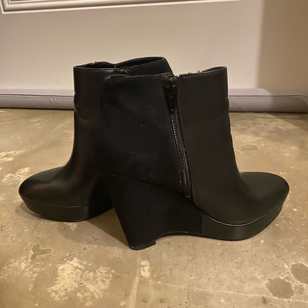 Black leather & suede Carlos Santana high heeled wedge booties.